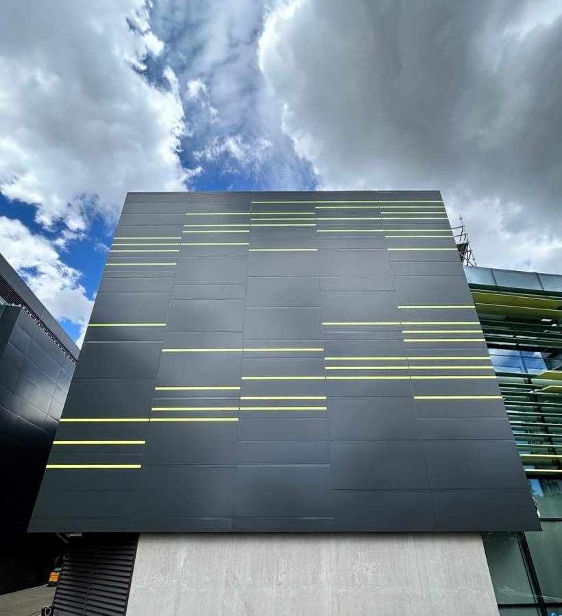 Reclad elevation in MondoClad panels with contrast reveals.