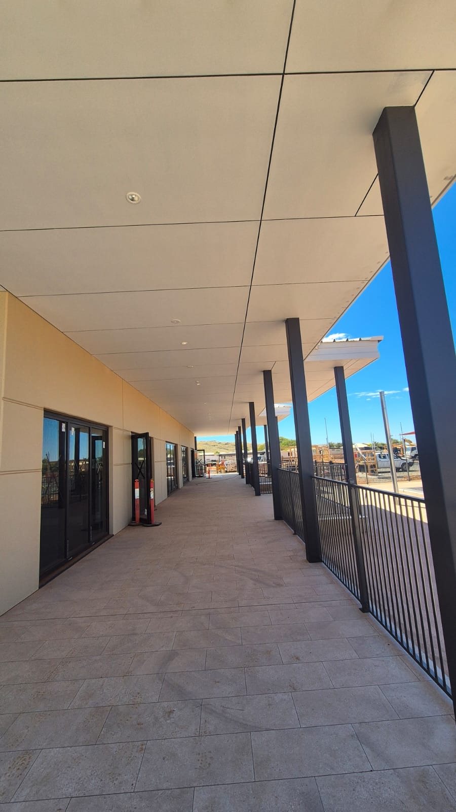 Covered walkway with CFC soffit running the length of the building.