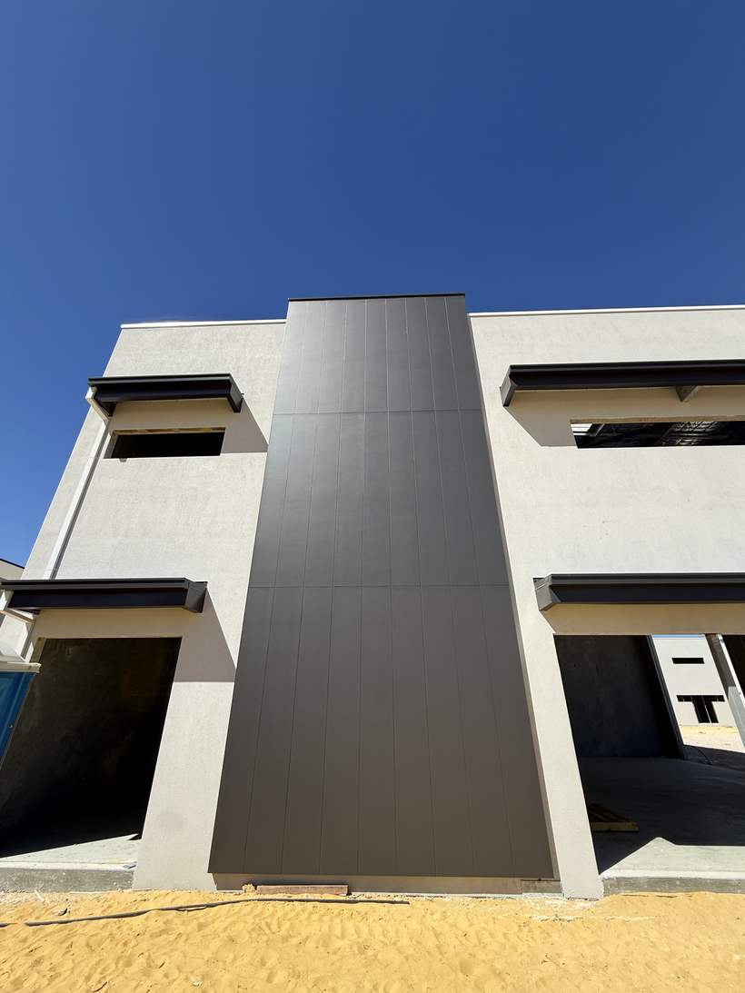 Cladding blade between two tenancy openings.