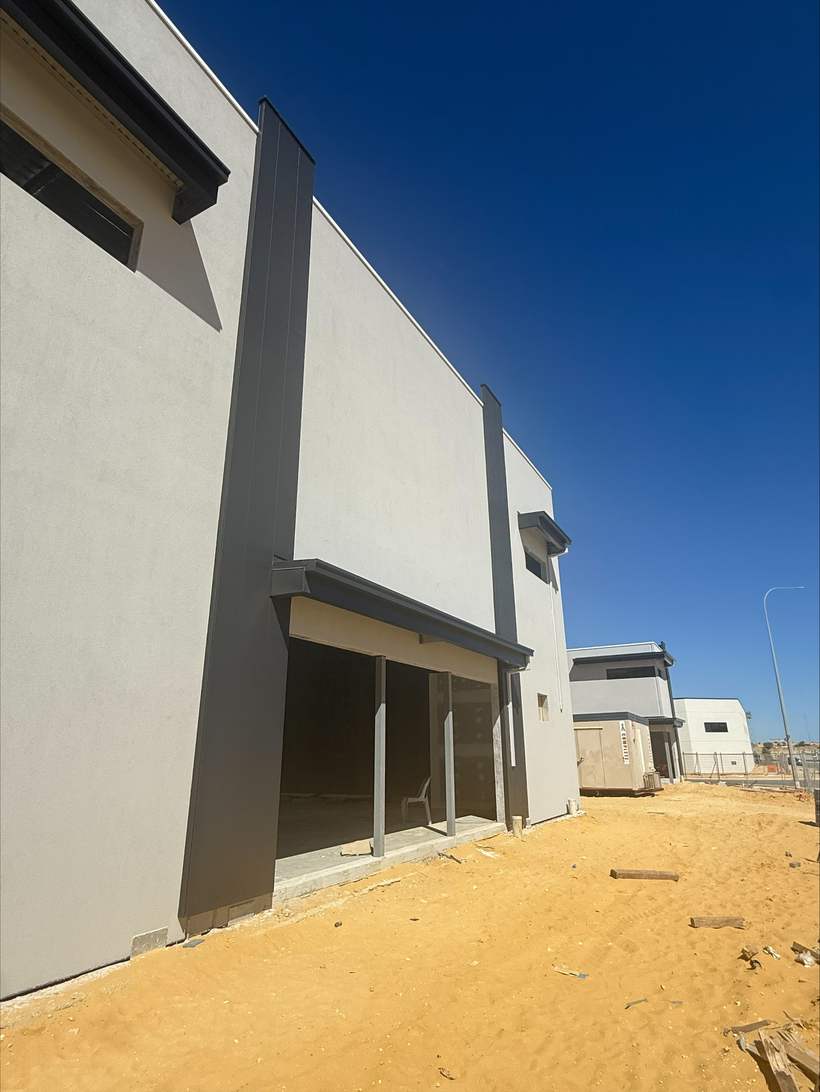 Two cladding blades framing a tenancy entry.